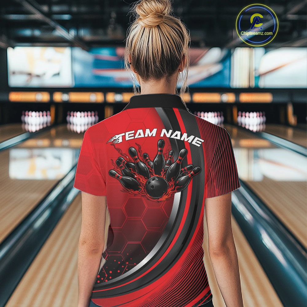 Back view of a women s black and red bowling quarter zip showcasing honeycomb accents and flame bowling ball and pins artwork inside a bowling center.