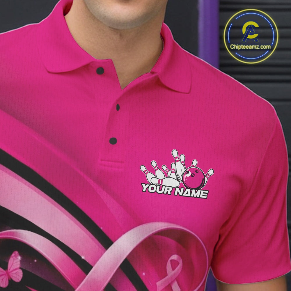 Close-up of the left chest area of a pink bowling polo shirt, featuring breast cancer awareness ribbon and butterfly-themed bowling design.