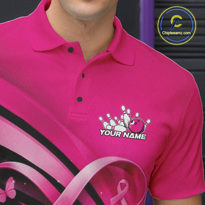 Close-up of the left chest area of a pink bowling polo shirt, featuring breast cancer awareness ribbon and butterfly-themed bowling design.