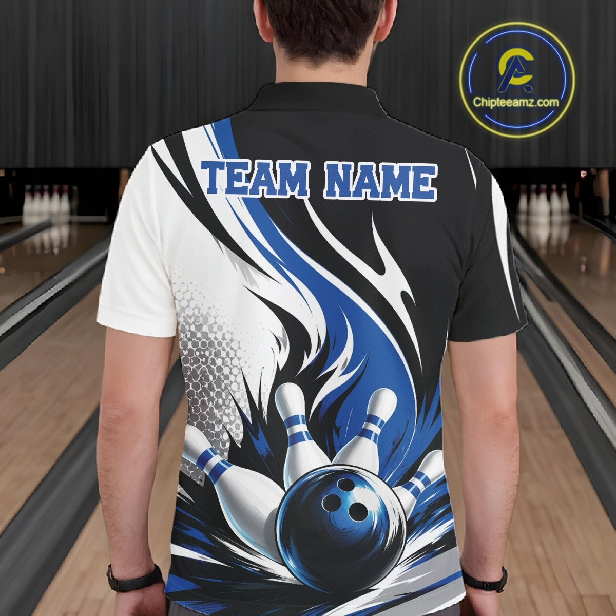 Back view of a male model wearing a white, black, and blue bowling polo shirt featuring a flaming bowling ball striking pins in a bowling lane.