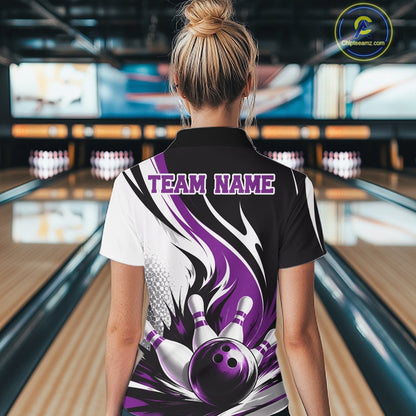 Back view of a female model wearing a white, black, and purple bowling polo shirt featuring a flaming bowling ball knocking down pins graphic at a bowling lane.