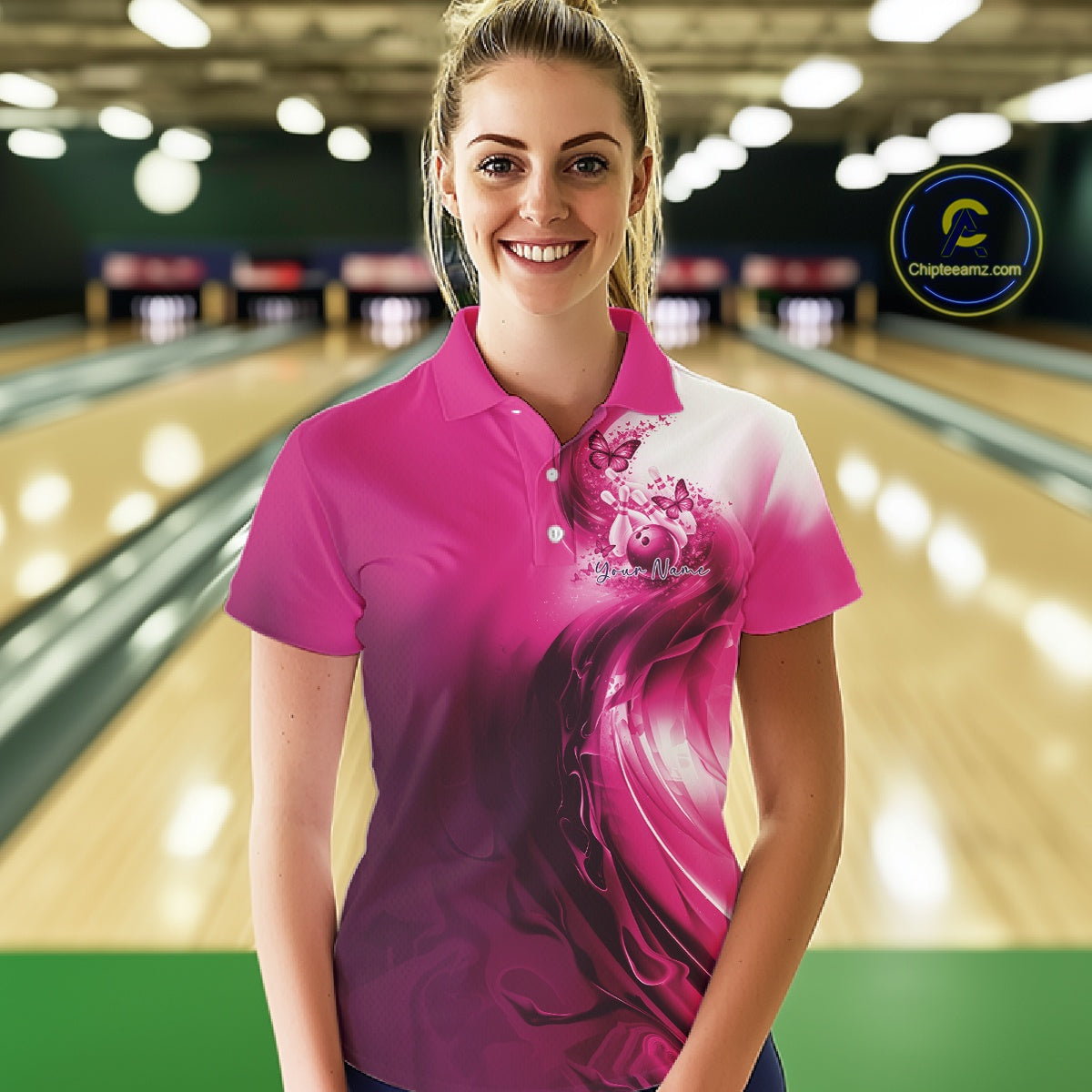 Front view of a female model in a pink bowling polo featuring butterfly artwork and colorful bowling graphics