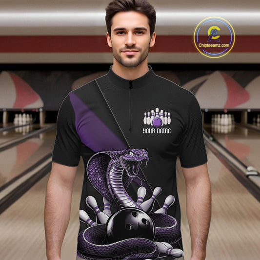 Male model in a bowling center wearing a black quarter-zip with purple cobra artwork and bowling pin details.