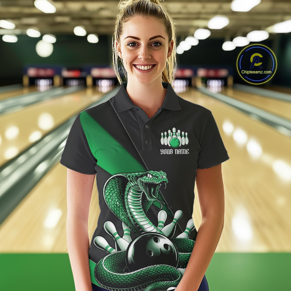 Female model in a bowling alley wearing a black bowling polo with green cobra artwork and bowling-themed accents.