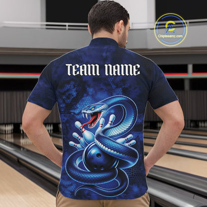 Front view of a mens bowling quarter-zip in a bowling lane featuring a blue cobra coiled around a bowling ball with scattered pins.