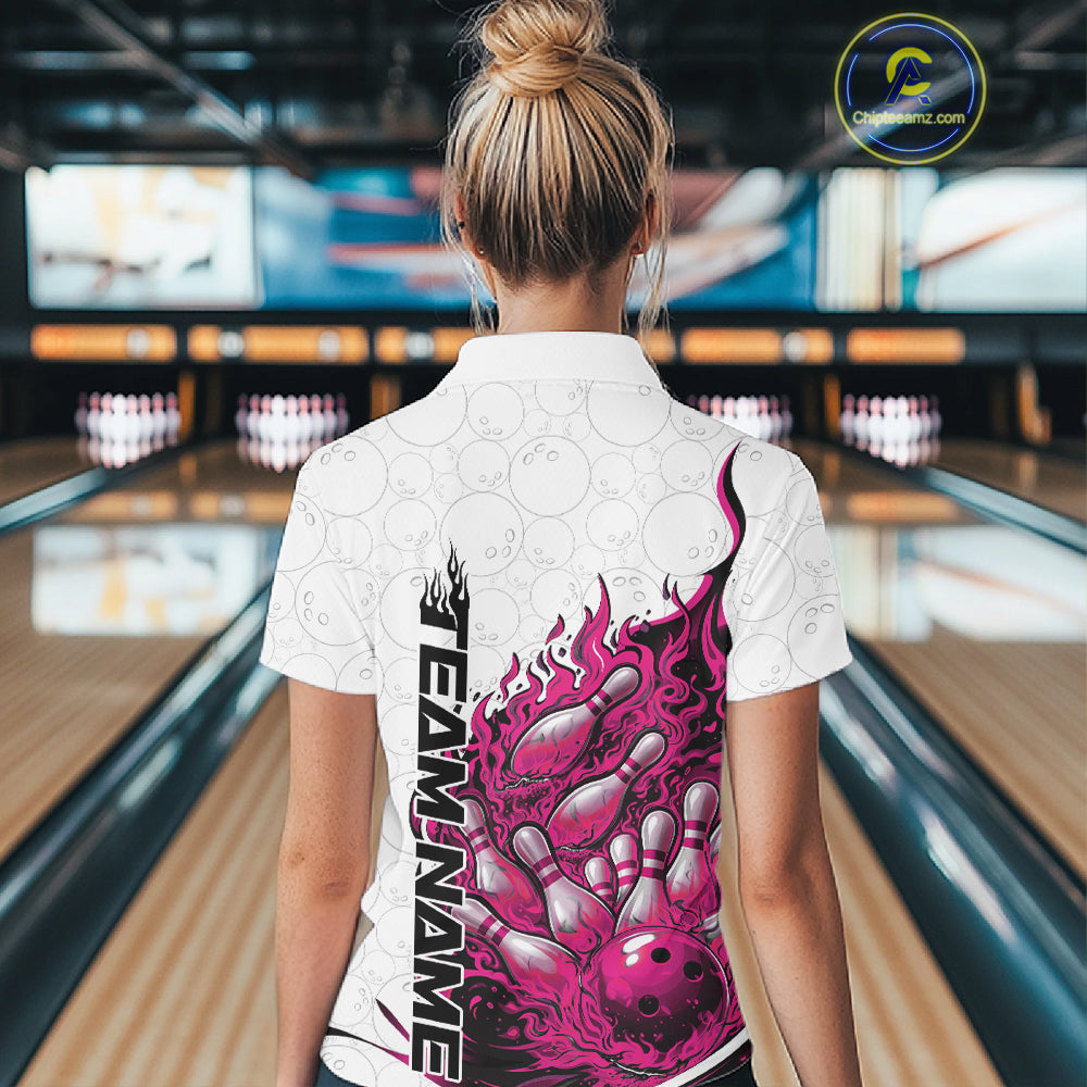 Back view female model in bowling lane wearing white and pink quarter zip featuring flaming bowling ball crashing into pins with dynamic fiery graphics.