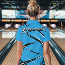 Load image into Gallery viewer, Back view of a female bowler in a bowling lane wearing a blue, black, and white bowling quarter zip shirt