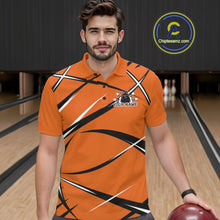 Load image into Gallery viewer, Front view of a male bowler in a bowling alley wearing an orange, black, and white bowling polo shirt with a sporty jersey design
