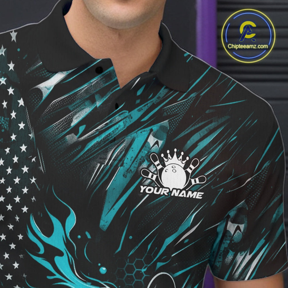 Close-up of the left chest on a black and turquoise blue bowling polo shirt featuring a flaming bowling ball striking pins with patriotic styling.