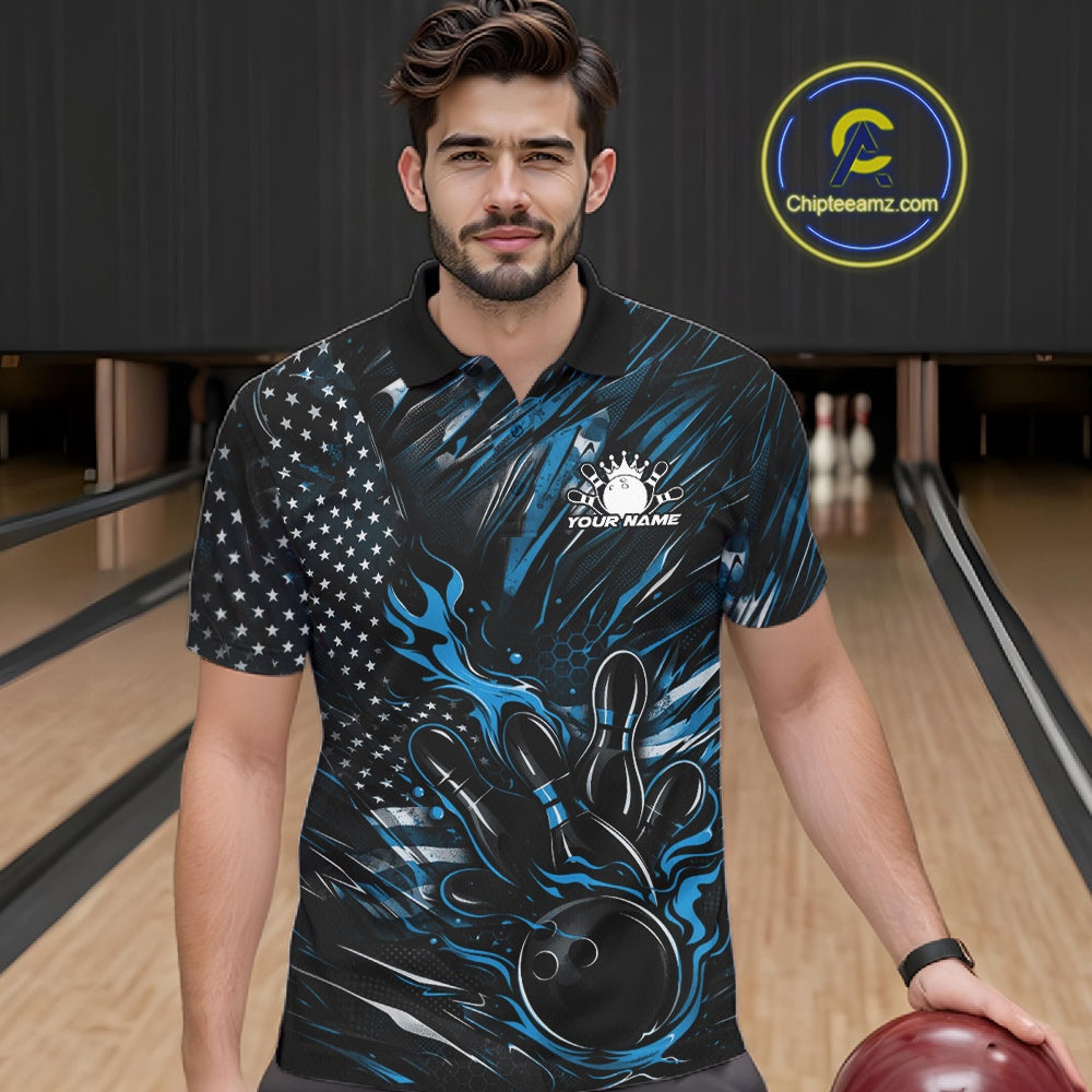 Male model wearing a black and blue bowling polo shirt at a bowling lane with patriotic bowling strike graphics and fiery details.