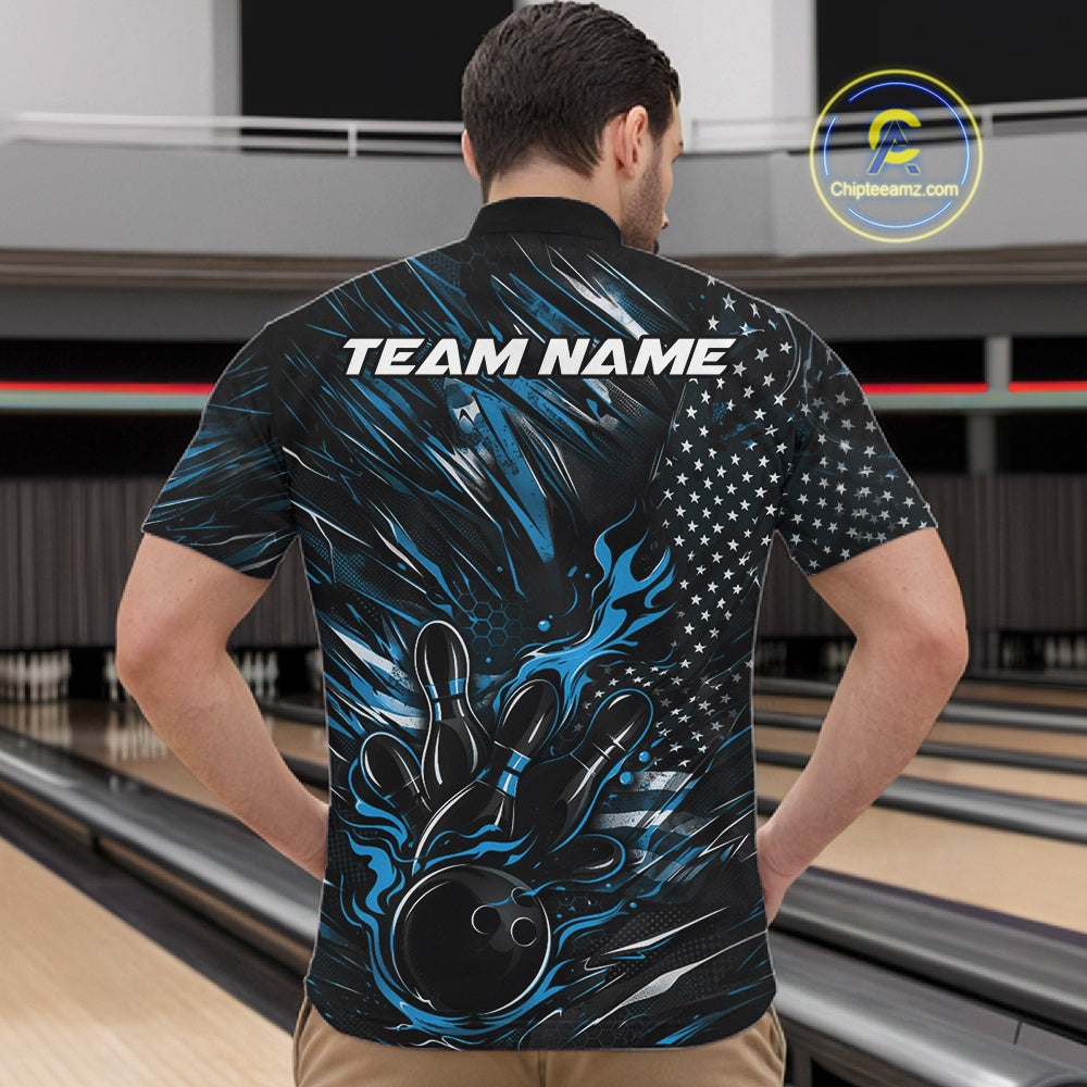 Front view of a male model in a bowling alley wearing a black and blue quarter-zip shirt featuring a bowling strike scene with flames.