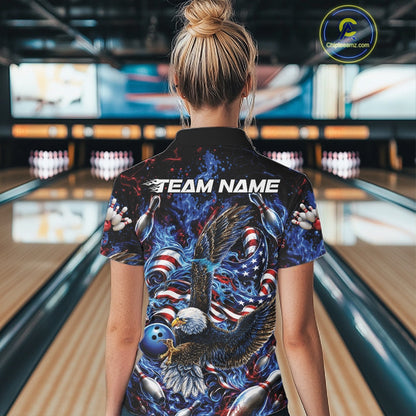 Back view of a female model in a bowling lane wearing a polo shirt with flaming bald eagle, blue bowling ball, American flag, and blue flames.
