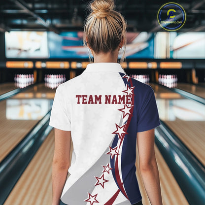 Back view female model at the bowling lane wearing a red, white, and blue bowling polo shirt with sweeping stars and stripe graphics.