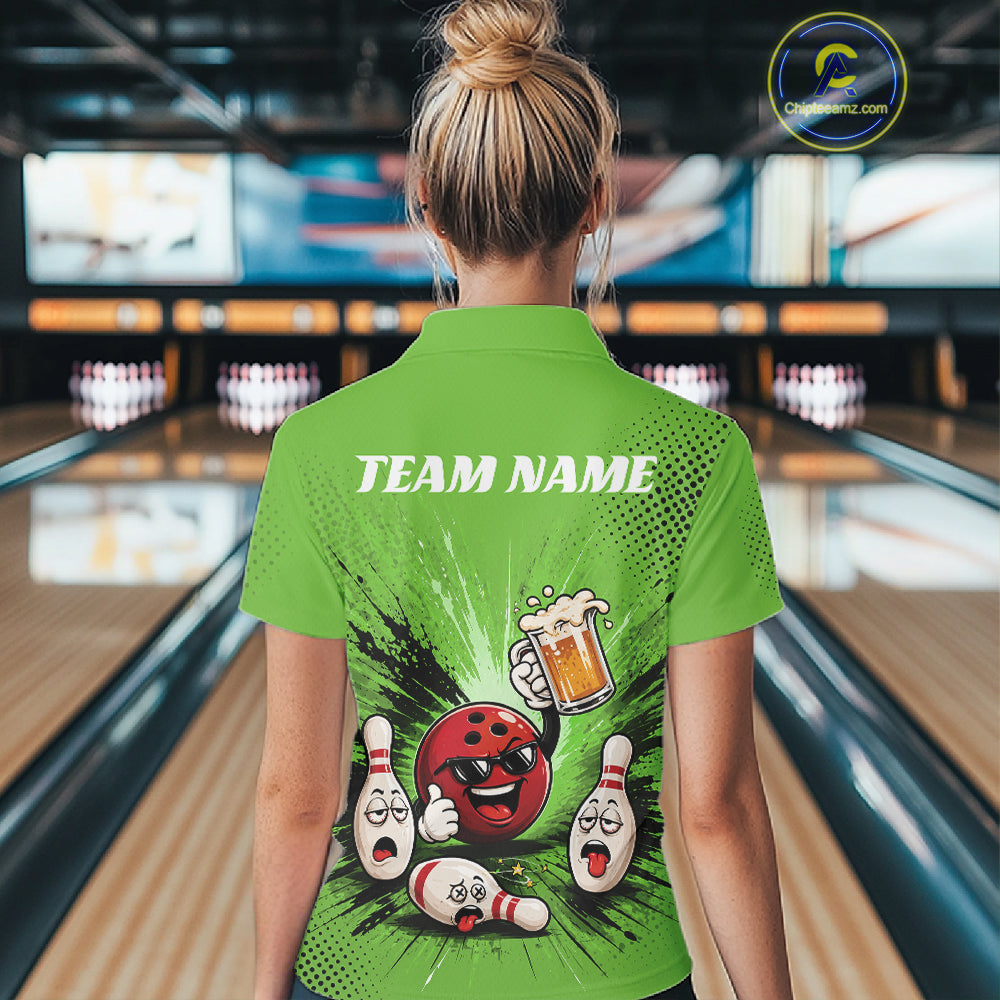 A woman viewed from behind wearing a bright green bowling-themed short-sleeve polo shirt with a large cartoon bowling graphic and the text 'TEAM NAME' on the back, standing in a bowling alley.