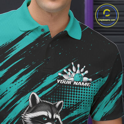 A close-up of a man wearing a custom bowling-themed polo shirt. The shirt features a black and teal color scheme with a raccoon graphic on the lower left, a bowling pin and ball design with the placeholder text 'YOUR NAME' 