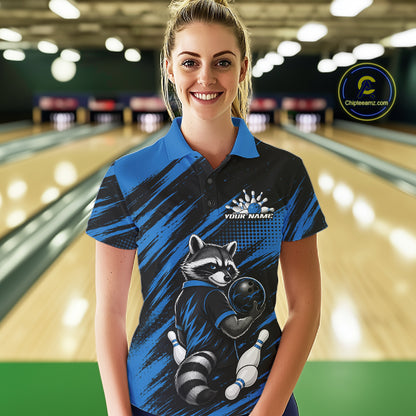 A woman stands in a bowling alley wearing a custom blue and black short-sleeve bowling polo shirt with a raccoon graphic and 'YOUR NAME' printed on the chest. A circular 'Chipeamz.