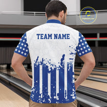 Load image into Gallery viewer, Male model showcasing the back design of a custom blue and white patriotic stars and stripes men's bowling quarter-zip shirt with a customizable "TEAM NAME" text template at a bowling alley lane.