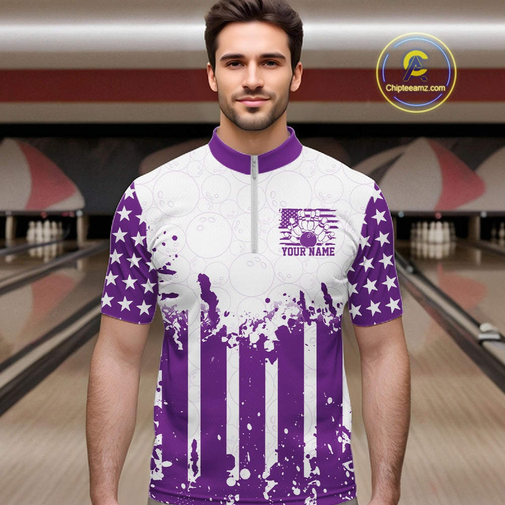 Male bowler posing on a lane wearing a personalized purple US flag performance bowling quarter-zip team shirt.