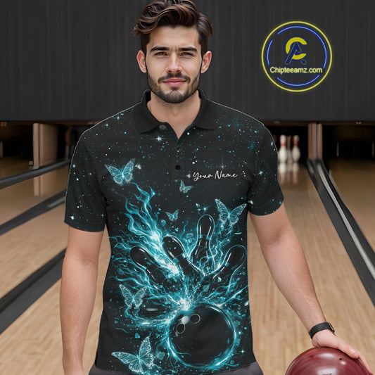 Male model wearing a black and turquoise blue bowling polo shirt at the lane with cosmic bowling strike artwork and luminous butterflies.