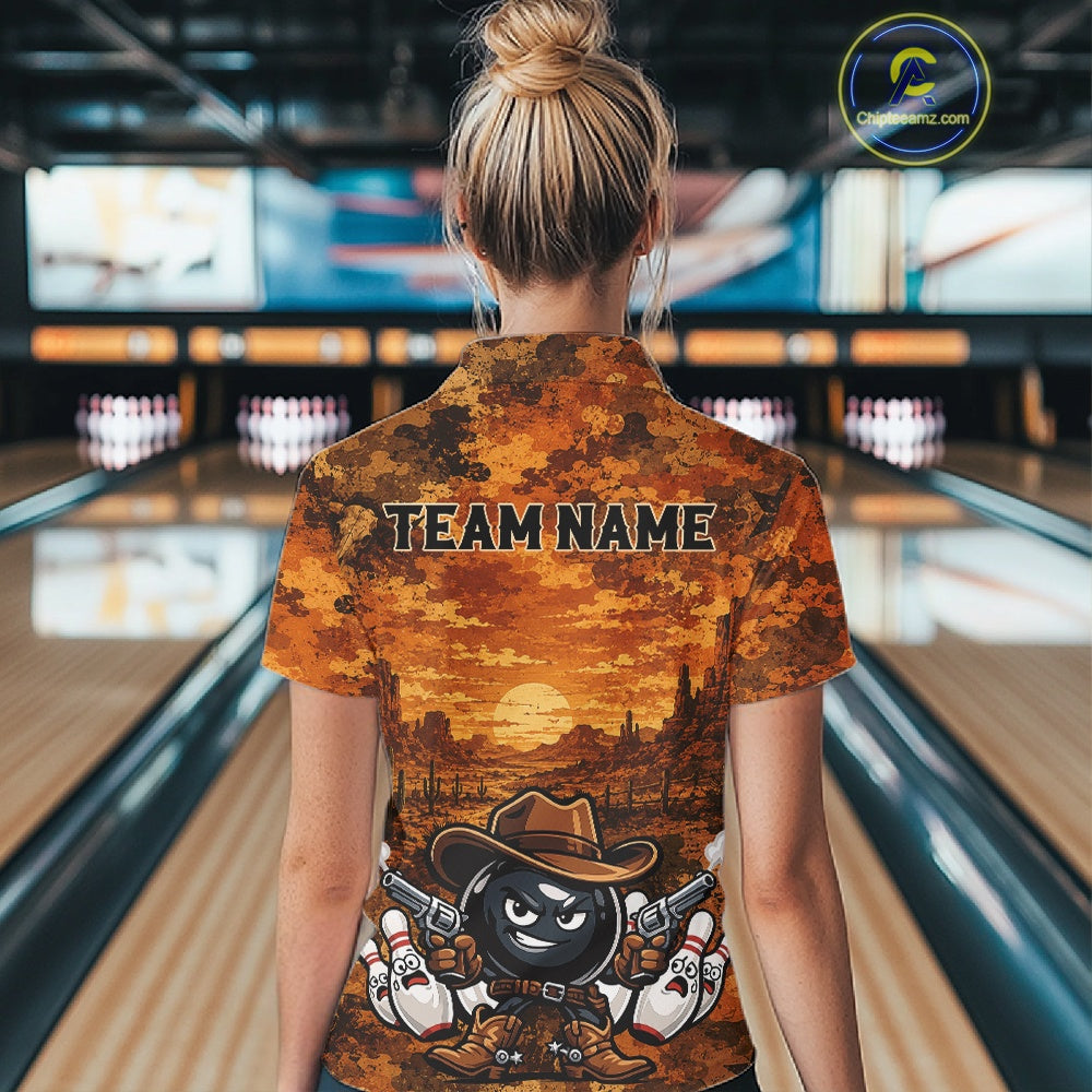 A woman viewed from behind wearing a short-sleeve bowling shirt with a western-themed desert sunset print and a cartoon character. The shirt features the text 'TEAM NAME' across the upper back.