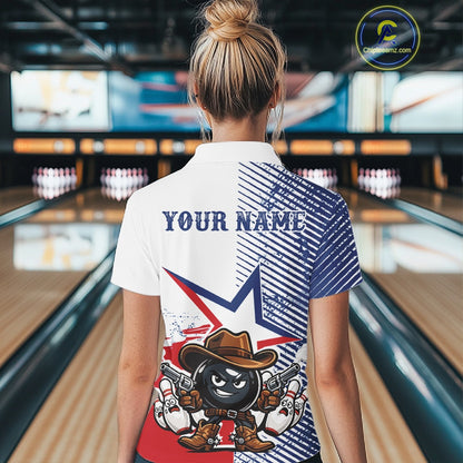 A woman viewed from behind wearing a custom-printed short-sleeve polo shirt in a bowling alley. The shirt features a patriotic red, white, and blue design with a cartoon bowling pin character wearing a cowboy hat and holding guns, alongside the text 'YOUR NAME'.