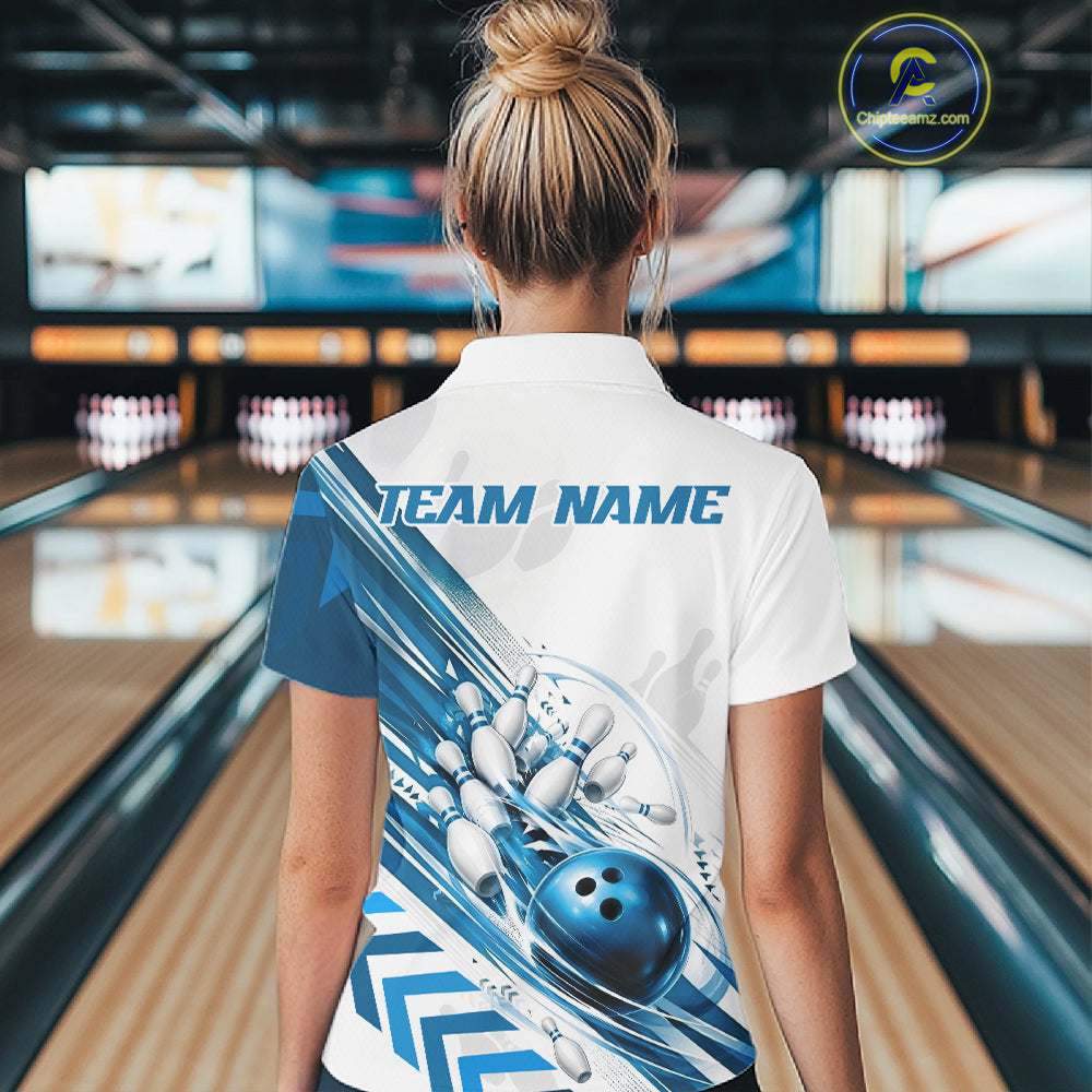 A woman viewed from behind wearing a white short-sleeve bowling-themed polo shirt with blue graphics and 'TEAM NAME' printed across the back, standing in a bowling alley.