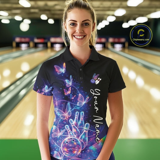 Front view of a female model in a black bowling polo featuring a starry galaxy background, glowing neon swirls, and hologram butterflies