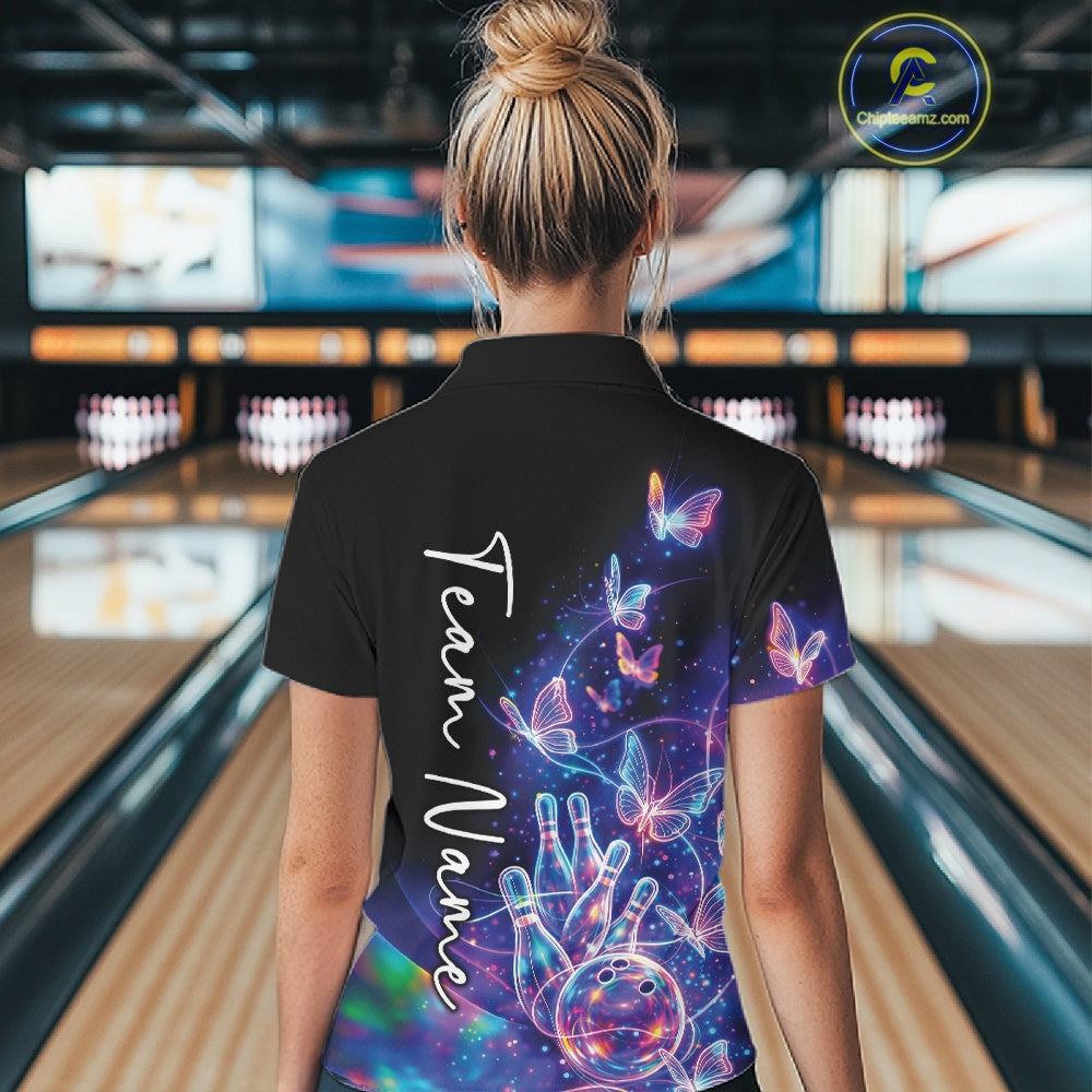 Female model in a black bowling quarter zip with starry galaxy artwork, neon swirls, and hologram butterflies, back view