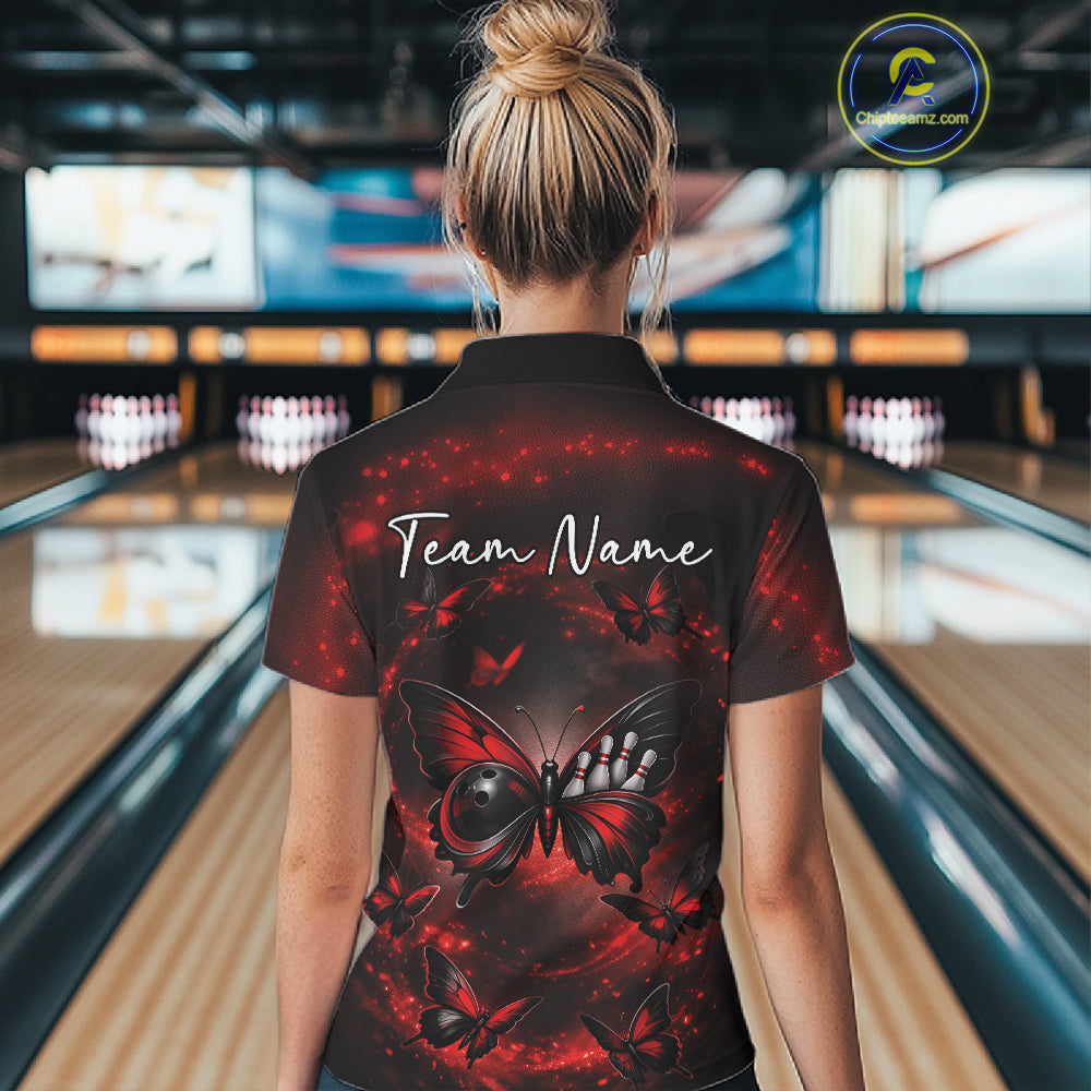 Back view of a female model at a bowling lane wearing a bowling quarter-zip shirt featuring a red and black butterfly motif with smoky accents.