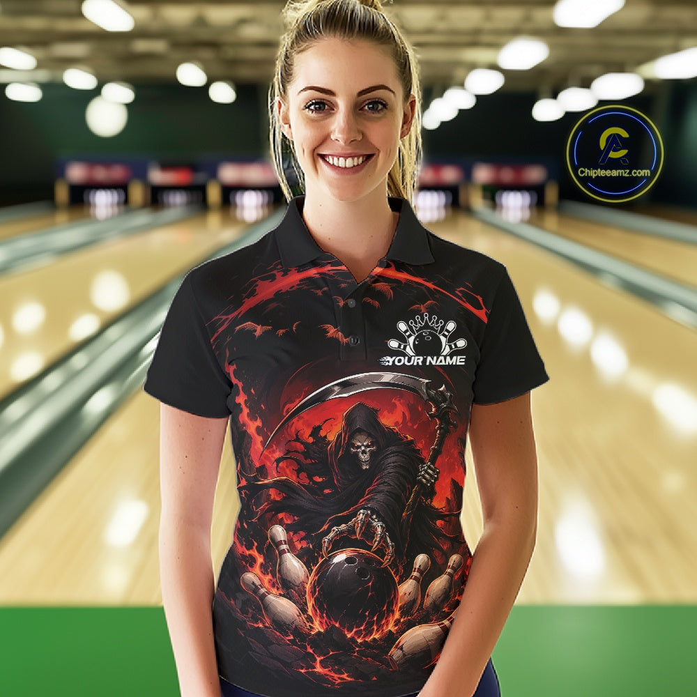 Front view of a female model wearing a black and red bowling polo shirt featuring a grim reaper commanding a blazing bowling ball crashing into scattered pins through swirling flames in a bowling lane.