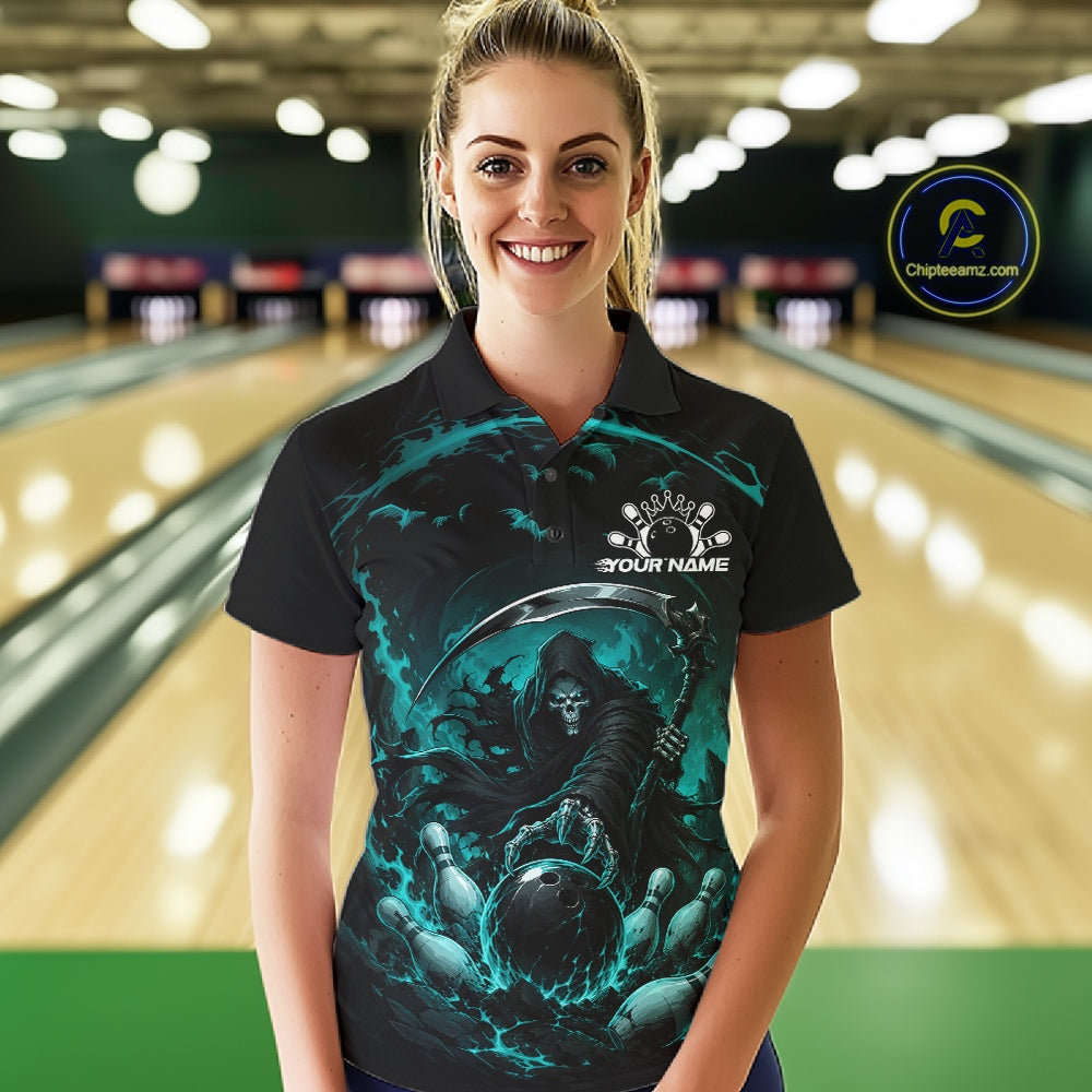 Front view of a female model wearing a black and cyan blue bowling polo shirt featuring a grim reaper commanding a blazing bowling ball crashing into scattered pins through swirling flames in a bowling lane.