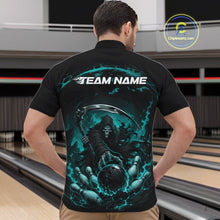 Load image into Gallery viewer, Front view of a male model wearing a black and cyan blue bowling quarter zip shirt featuring a grim reaper commanding a blazing bowling ball crashing through scattered pins amid swirling flames in a bowling lane.