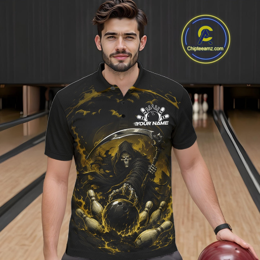 Front view of a male model wearing a black and yellow bowling polo shirt featuring a grim reaper commanding a blazing bowling ball crashing through scattered pins amid swirling flames in a bowling lane.