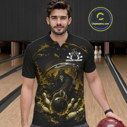 Front view of a male model wearing a black and yellow bowling polo shirt featuring a grim reaper commanding a blazing bowling ball crashing through scattered pins amid swirling flames in a bowling lane.