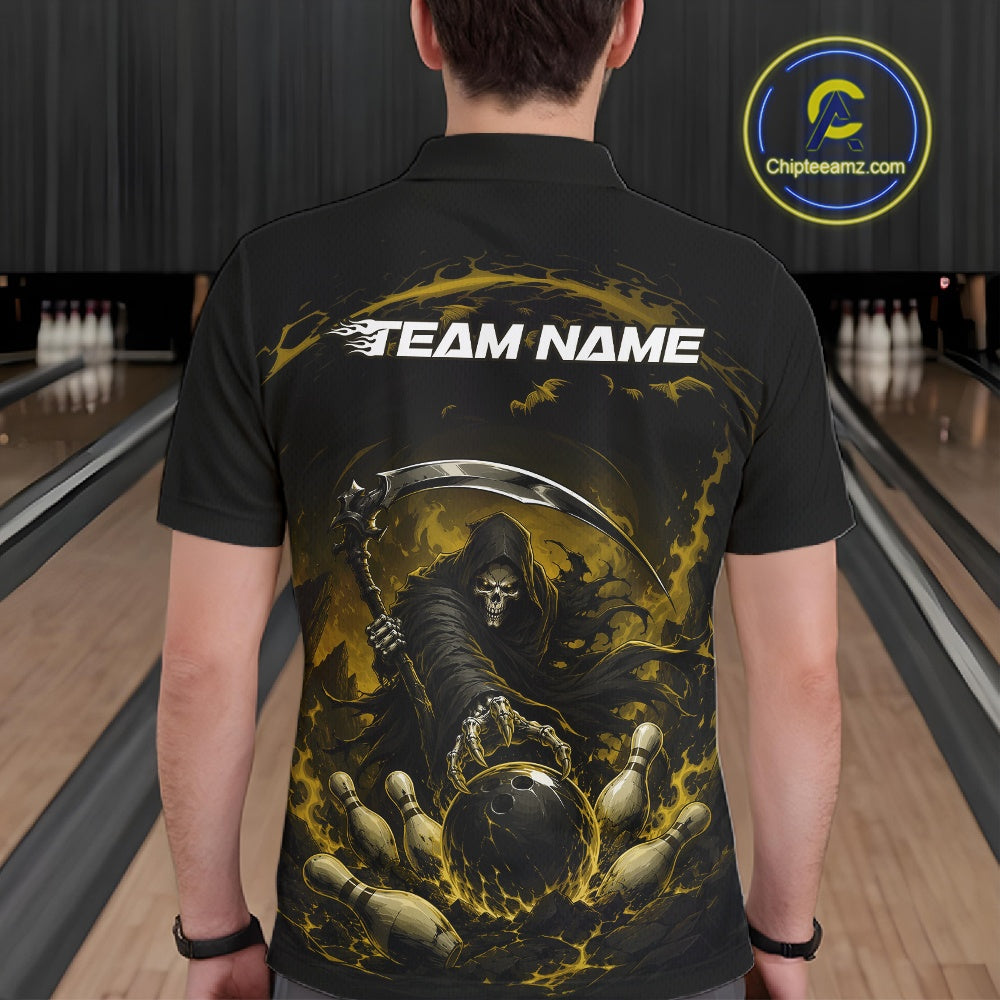 Back view of a male model wearing a black and yellow bowling polo shirt featuring a grim reaper reaching through swirling flames to command a blazing bowling ball crashing into scattered pins in a bowling lane.