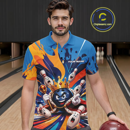 Front view of a male model wearing a bowling polo shirt showcasing a crowned cartoon bowling ball with a royal scepter, animated bowling pins, and colorful paint splash artwork in a bowling lane.