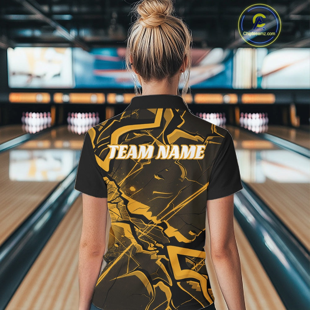 Back view of a womens black and yellow bowling polo displaying cracked geometric linework and bold accents.