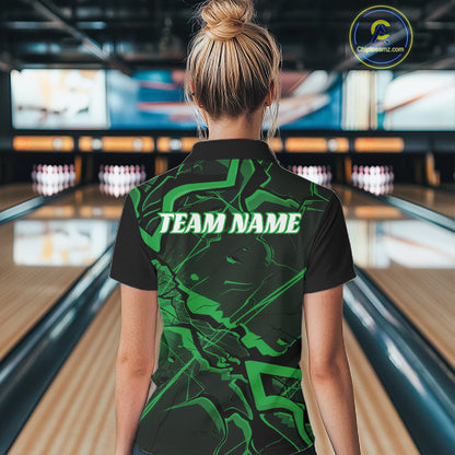 Back view of a black and green quarter-zip displaying a futuristic cracked geometric motif with angular accents.