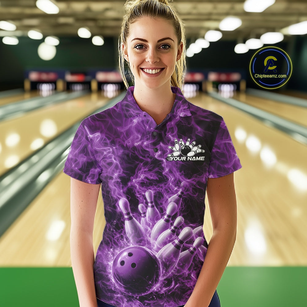 Female model wearing a bowling polo at the bowling alley with purple bowling ball graphics and fiery details.