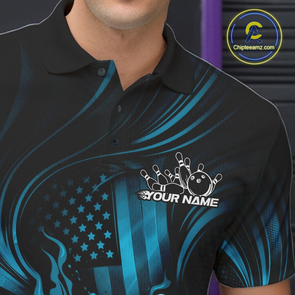 Close-up of a black and turquoise blue bowling polo shirt left chest showcasing patriotic flames and bowling strike design.