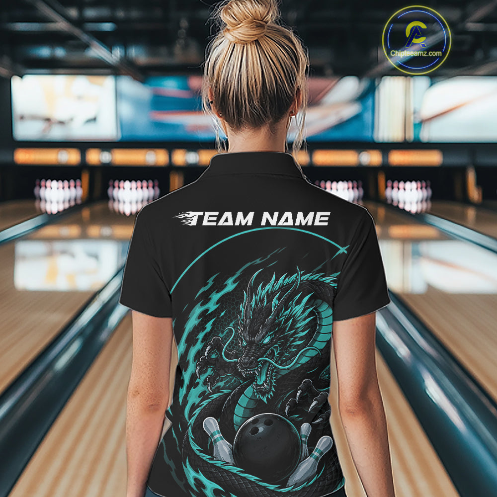 Back view of a female model in a bowling alley wearing a blue custom bowling polo shirt featuring an aggressive dragon with flames in a dynamic and energetic design.