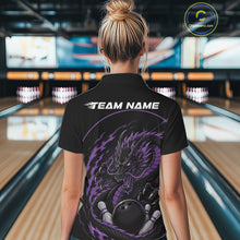 Load image into Gallery viewer, Back view of a female model in a bowling alley wearing a purple custom bowling polo shirt featuring an aggressive dragon with flames in a dynamic and energetic design.