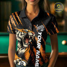 Load image into Gallery viewer, Front view of a female model wearing a polo shirt with a roaring tiger gripping billiard balls through orange claw marks.