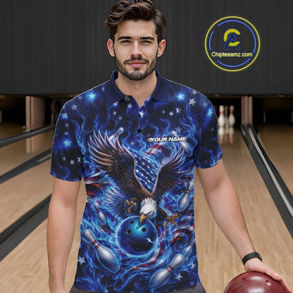 Front view of a male model at a bowling lane wearing a polo shirt with eagle artwork, bowling ball, flag accents, pins, and blue flames.