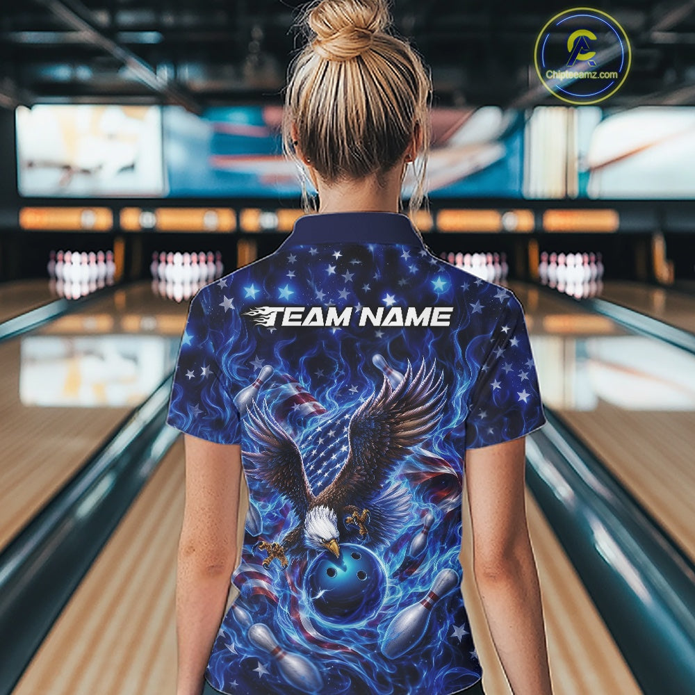 Female model back view at the bowling lane wearing a polo shirt with eagle reaching toward a bowling ball, flag accents, pins, and blue flames.