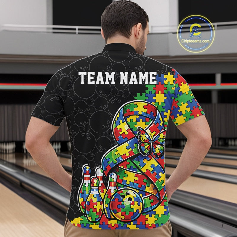 At A Bowling Alley, Front View Of Male Model In Black Quarter-Zip Bowling Shirt, Autism Ribbon Puzzle Graphic With Butterfly And Pins Action Illustration