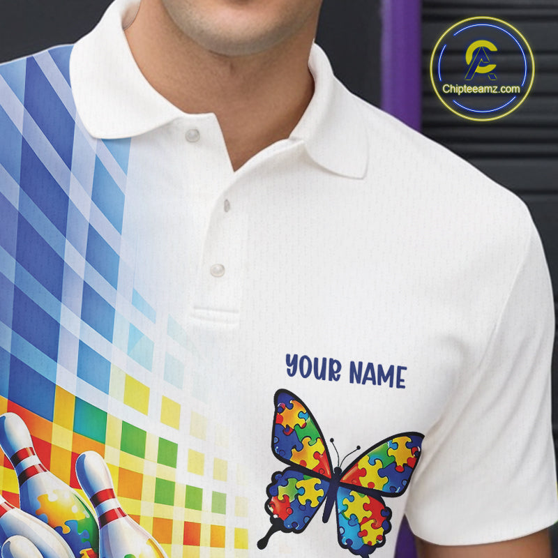 Close-up left chest detail of white and blue bowling polo shirt featuring puzzle pattern bowling butterfly and ribbon emblem design