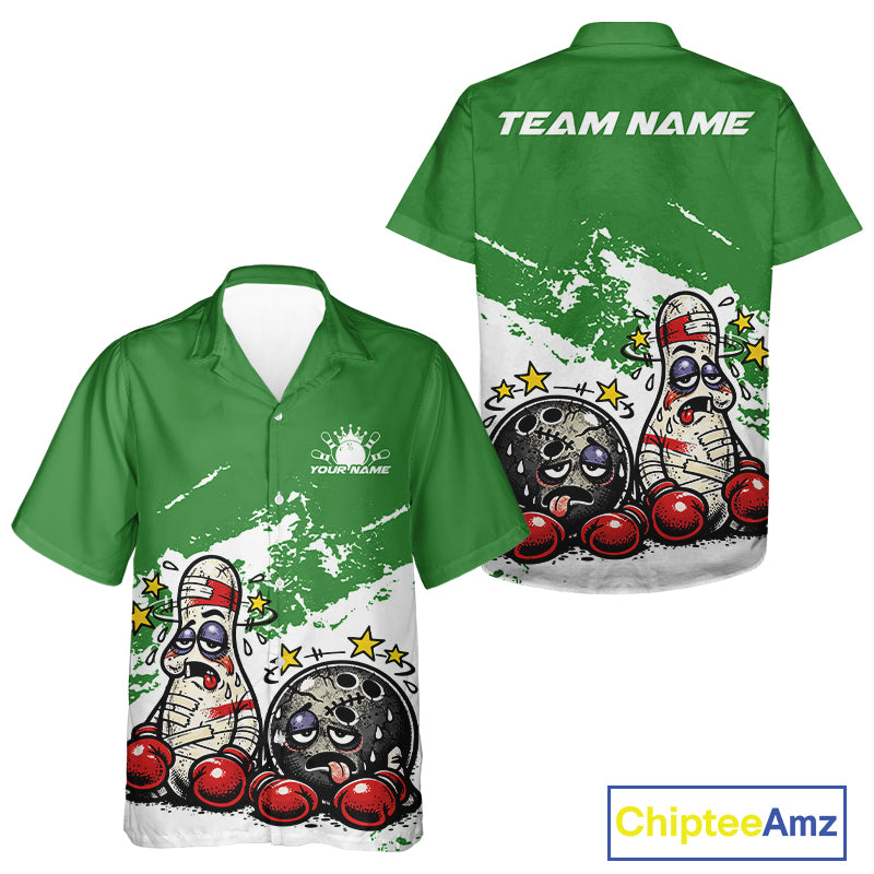 Front and back view of a button-up bowling shirt mockup in green and white, featuring cartoon boxing-style bowling ball and pin illustrated as beaten-up boxers.