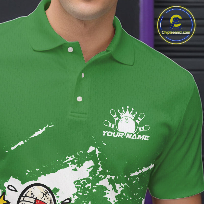 Close-up view of left chest area of a green and white polo shirt, showing small boxing-style bowling ball and pin graphic detail.