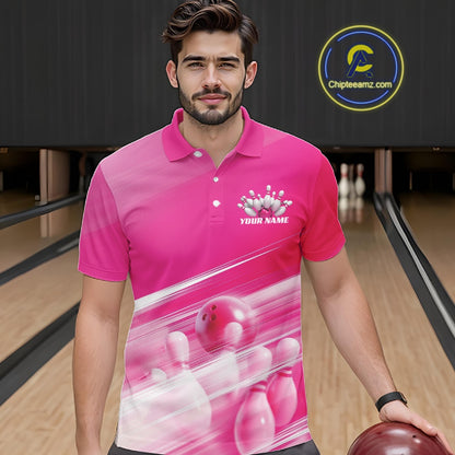 Front view male model at the bowling lane wearing a pink bowling polo shirt with bowling ball and pins in a geometric pattern.